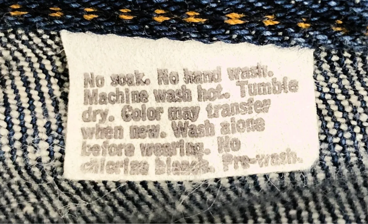 Levi’s big E dark wash white tab jeans (26”)